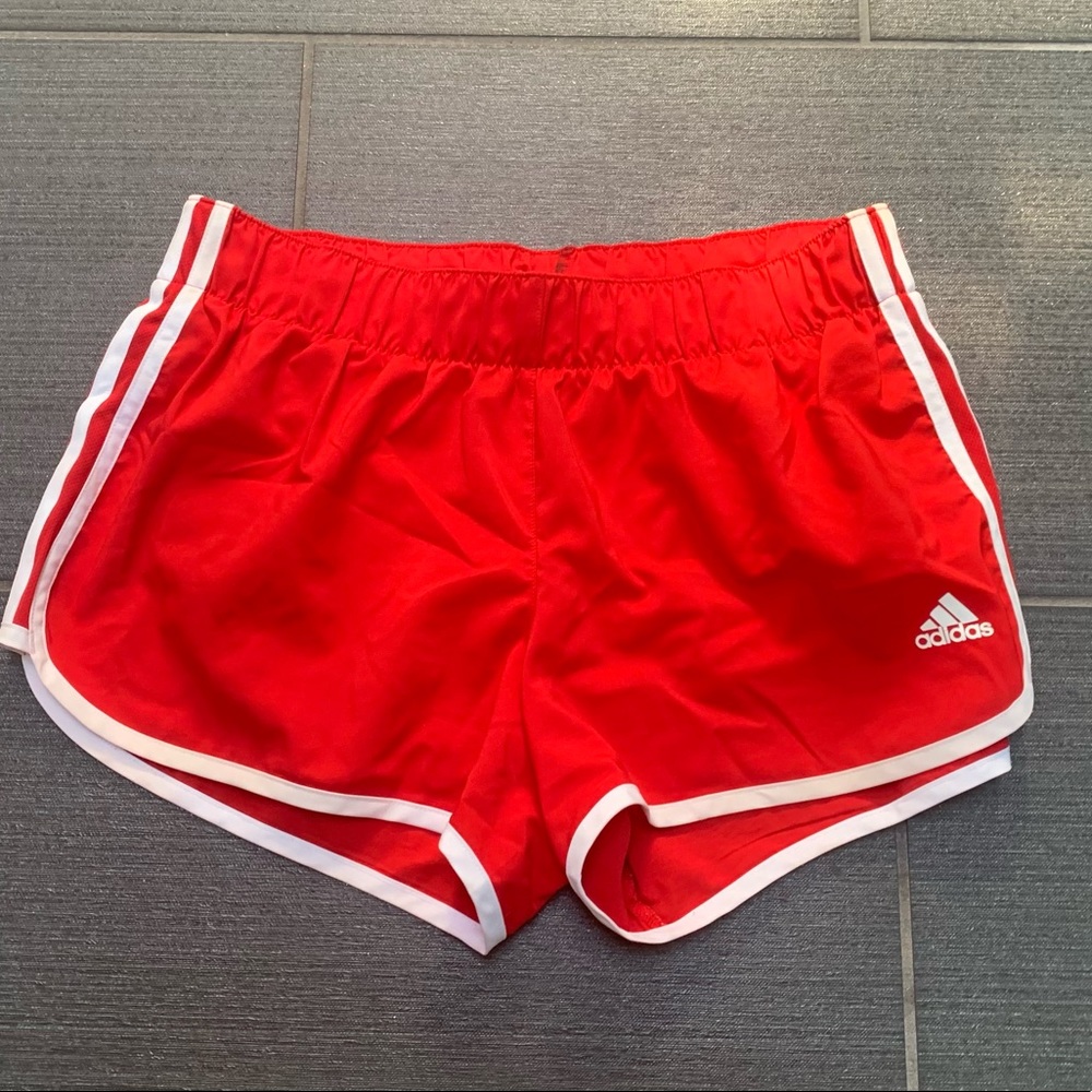 Red adidas running shorts, size M
